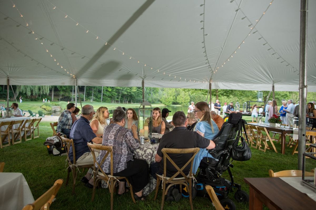 Farm Chairs and Natural Padded Folding Chairs at a Summer BBQ gathering