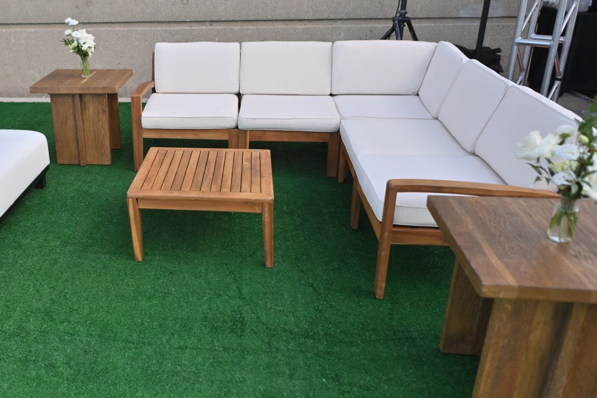 Teak Acacia Sectional and Coffee Table at a summer outdoor event