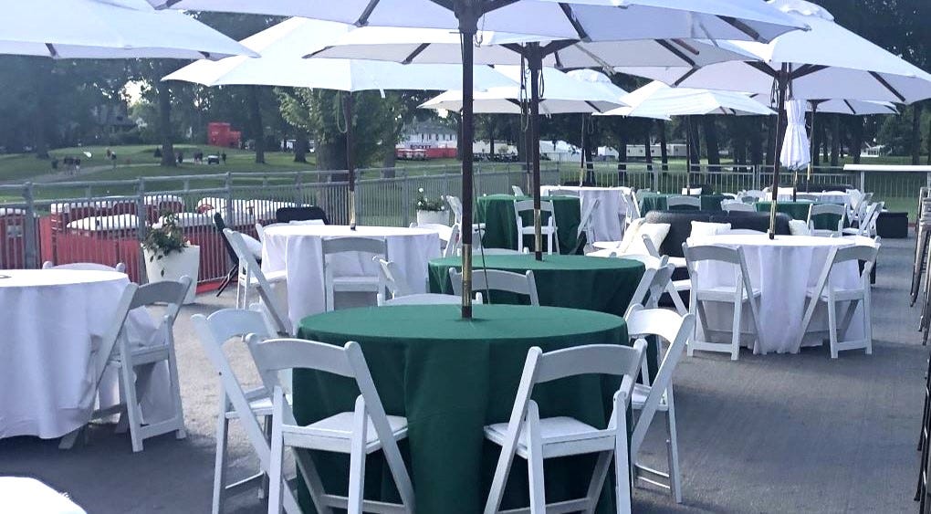Umbrella Table with White Padded Folding Chairs