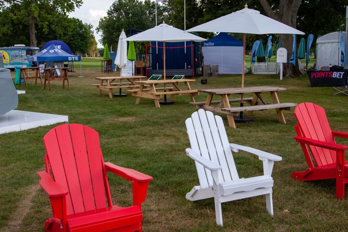 Wooden Picnic Tables with Market Umrellas and Adirondack Chairs